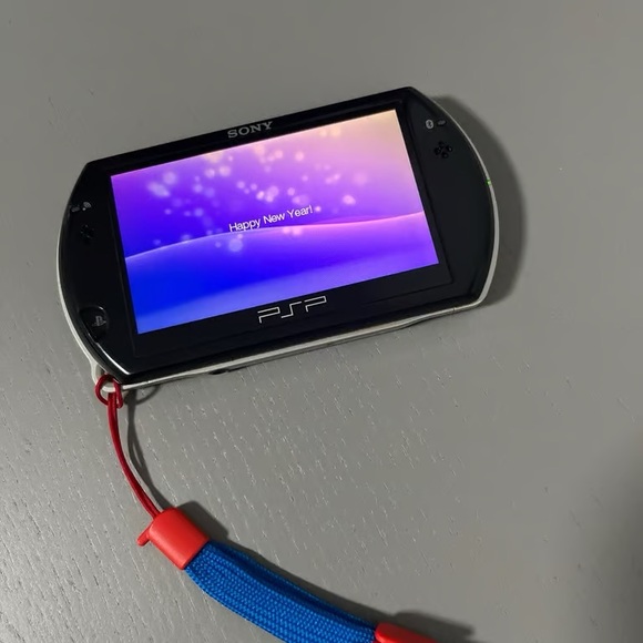 Sony Handheld Console with Black and Red Highlights